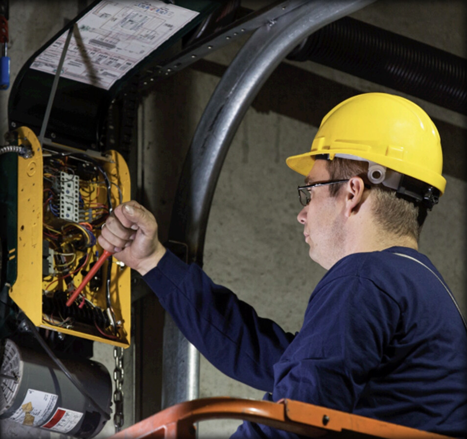 service technician working on a door for a dock